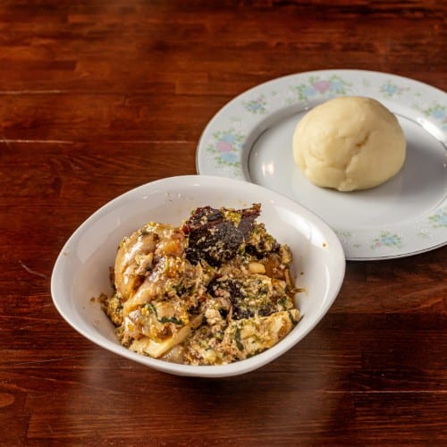 Okra Soup with Yam Fufu or Garri or Corn Fufu.
