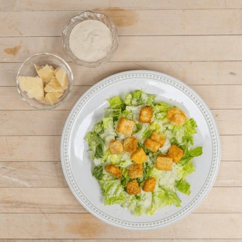 Buckets of Caesar Salad.