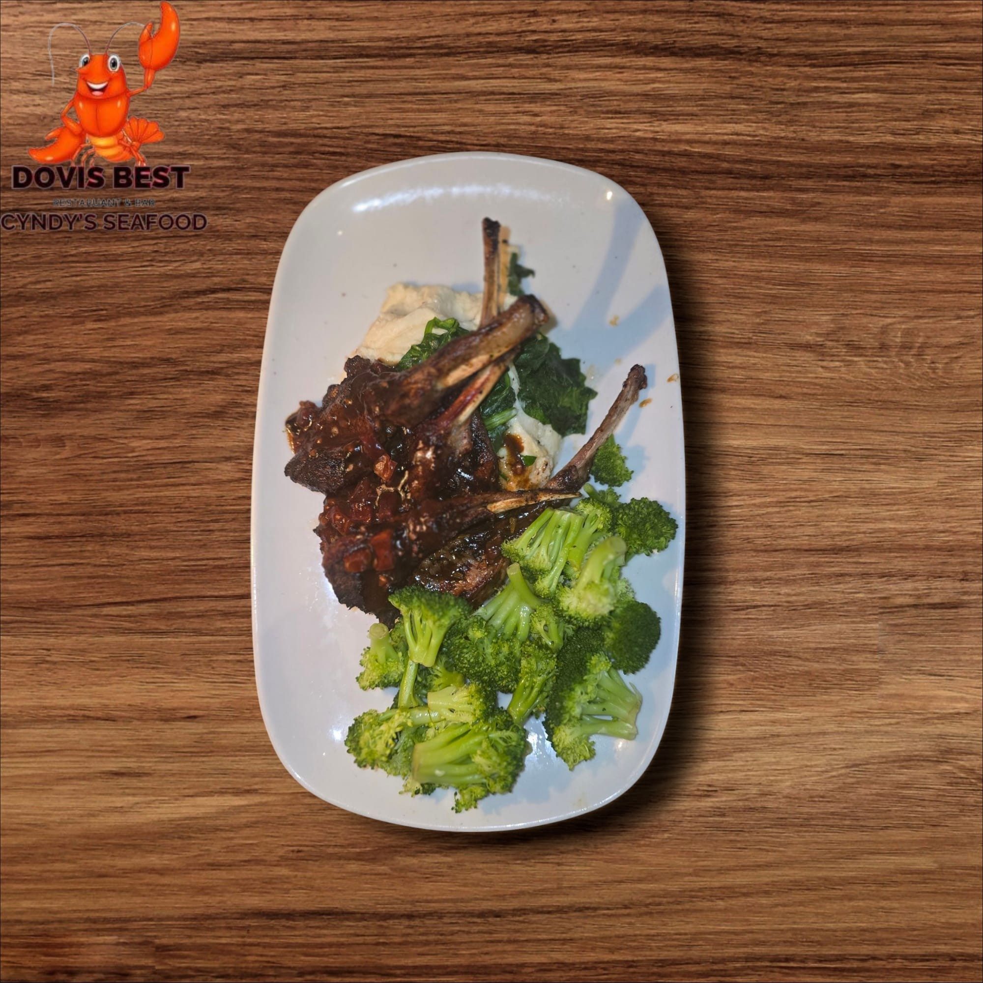 Grilled Lamb Chop with Jalloff Rice and Sauteed Broccoli or Asparagus or Collard Green or Spinach.