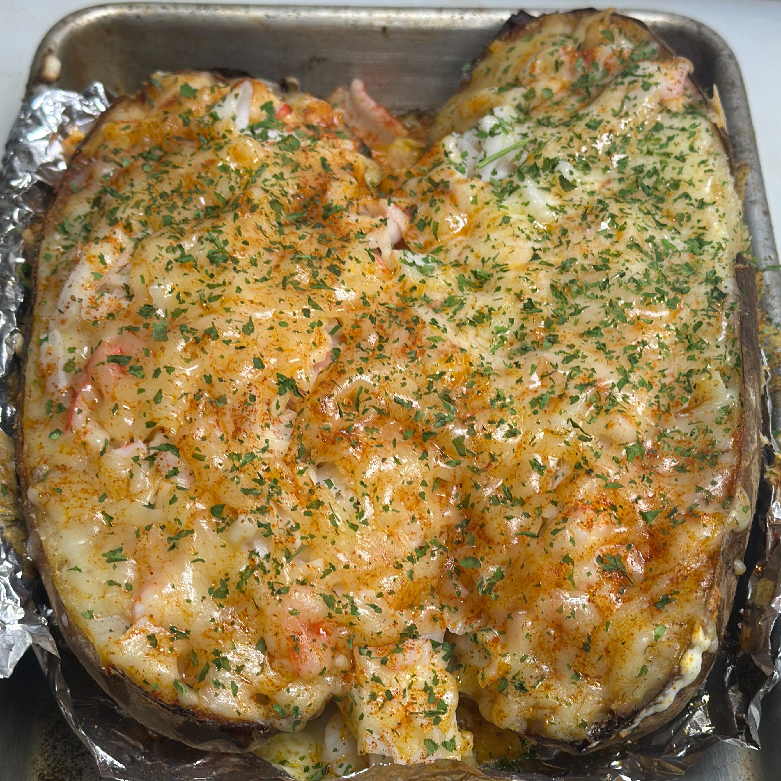 Seafood loaded baked potatoes.