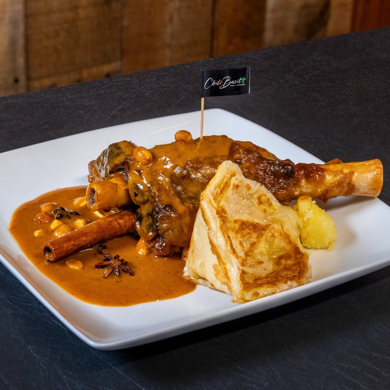Lamb shank massaman with roti.