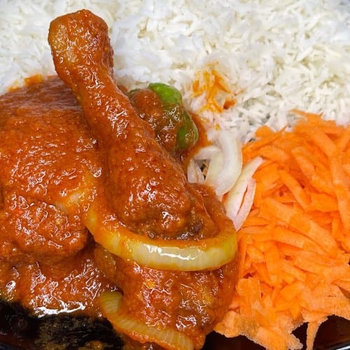 Chicken Stew serves with fufu or Rice.