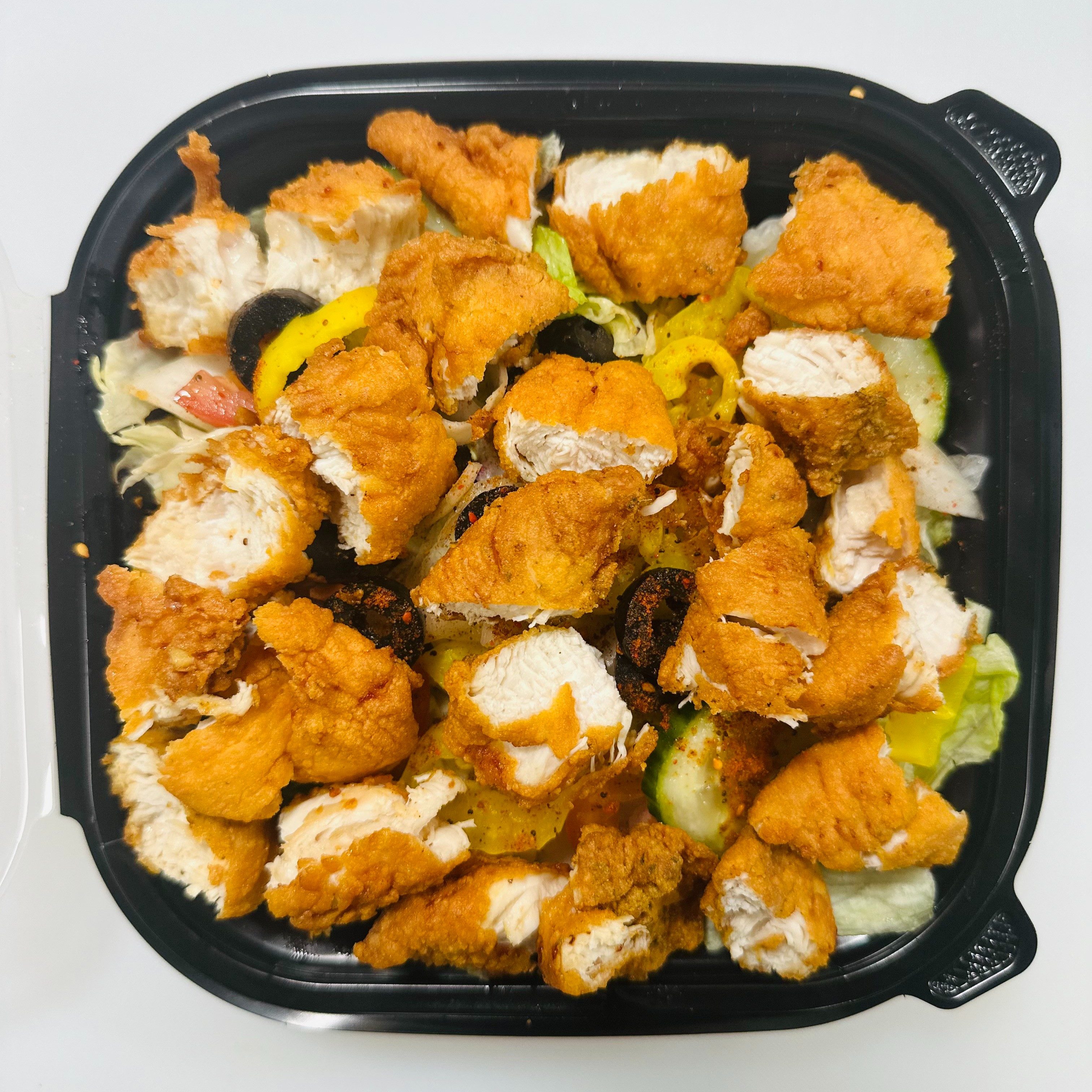 Fried chicken over rice.