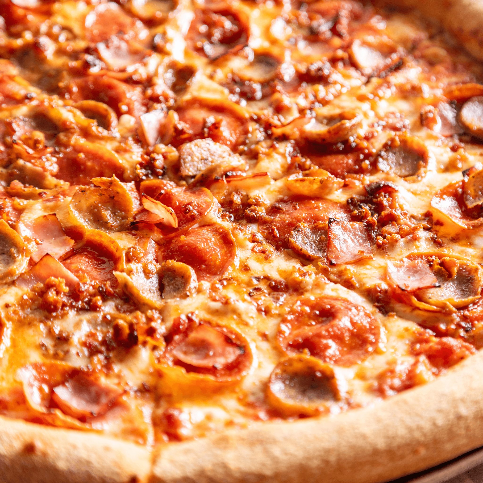 Meat lovers pizza slice.