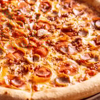 Meat lovers pizza slice