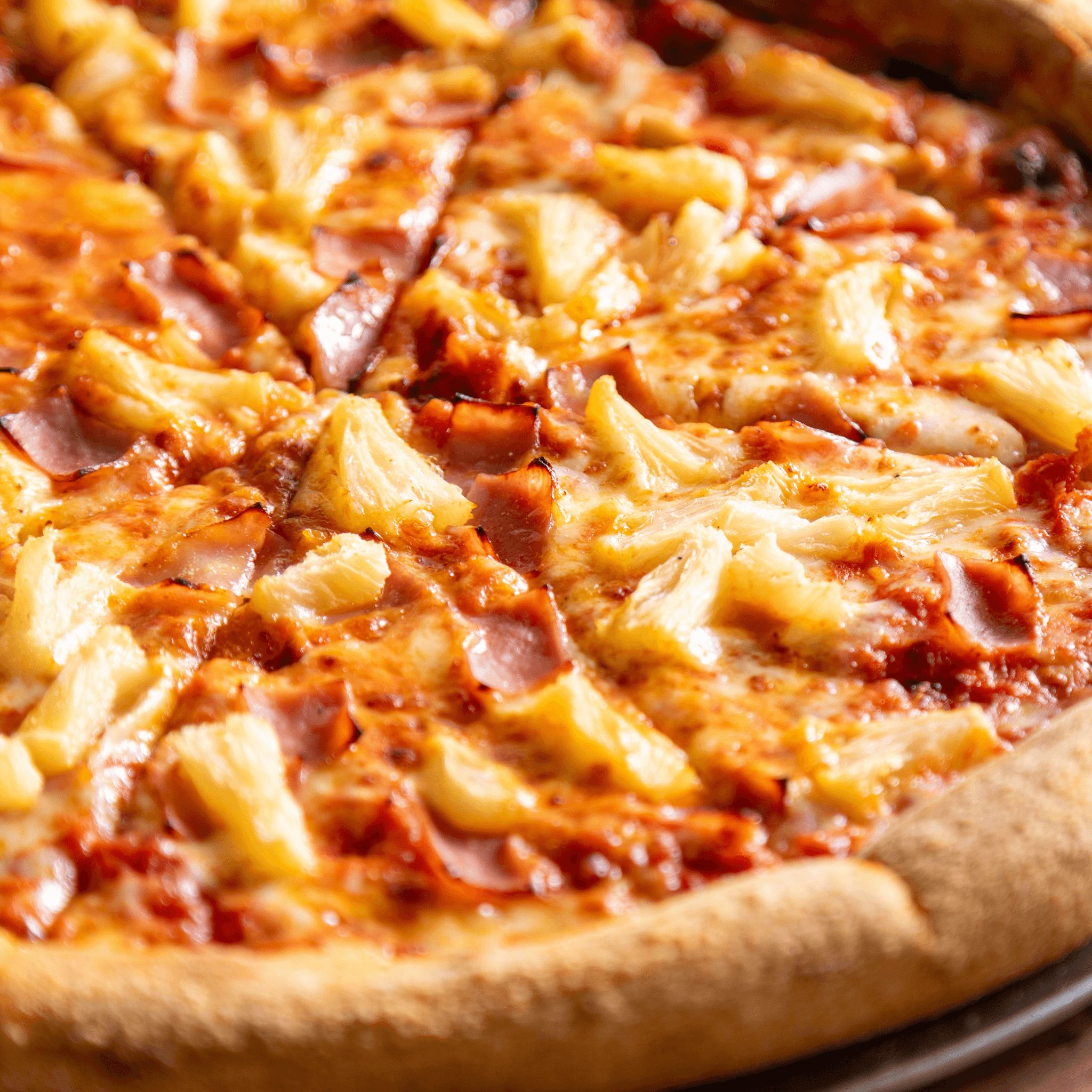 Hawaiian pizza slice.