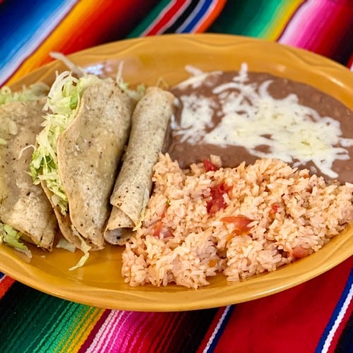 E.  Two Rolled One Folded Taco Dinner.