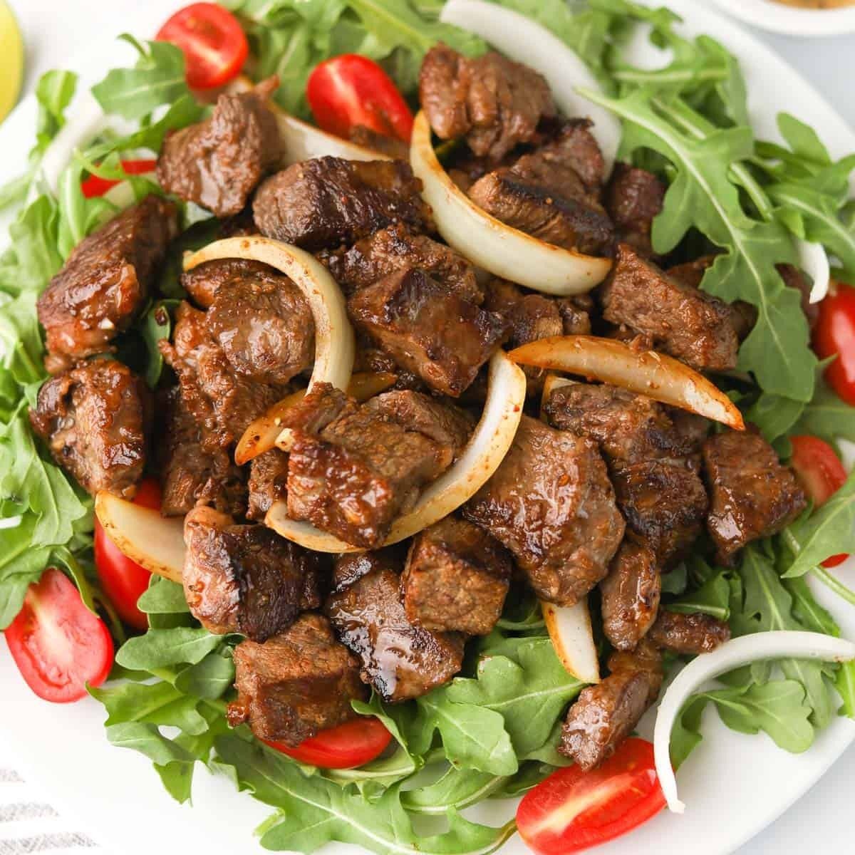 S2. Shaky Beef Over White Rice (Com Bo LLac).