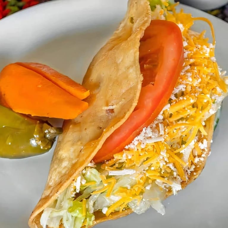 Flavor with Our Crispy Shredded Chicken Taco!