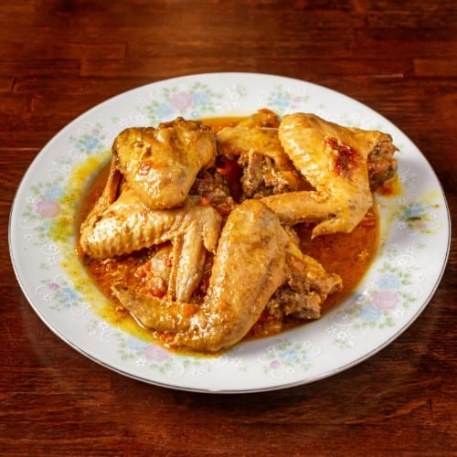 Spicy Chicken with Jollof Rice or Plantains.