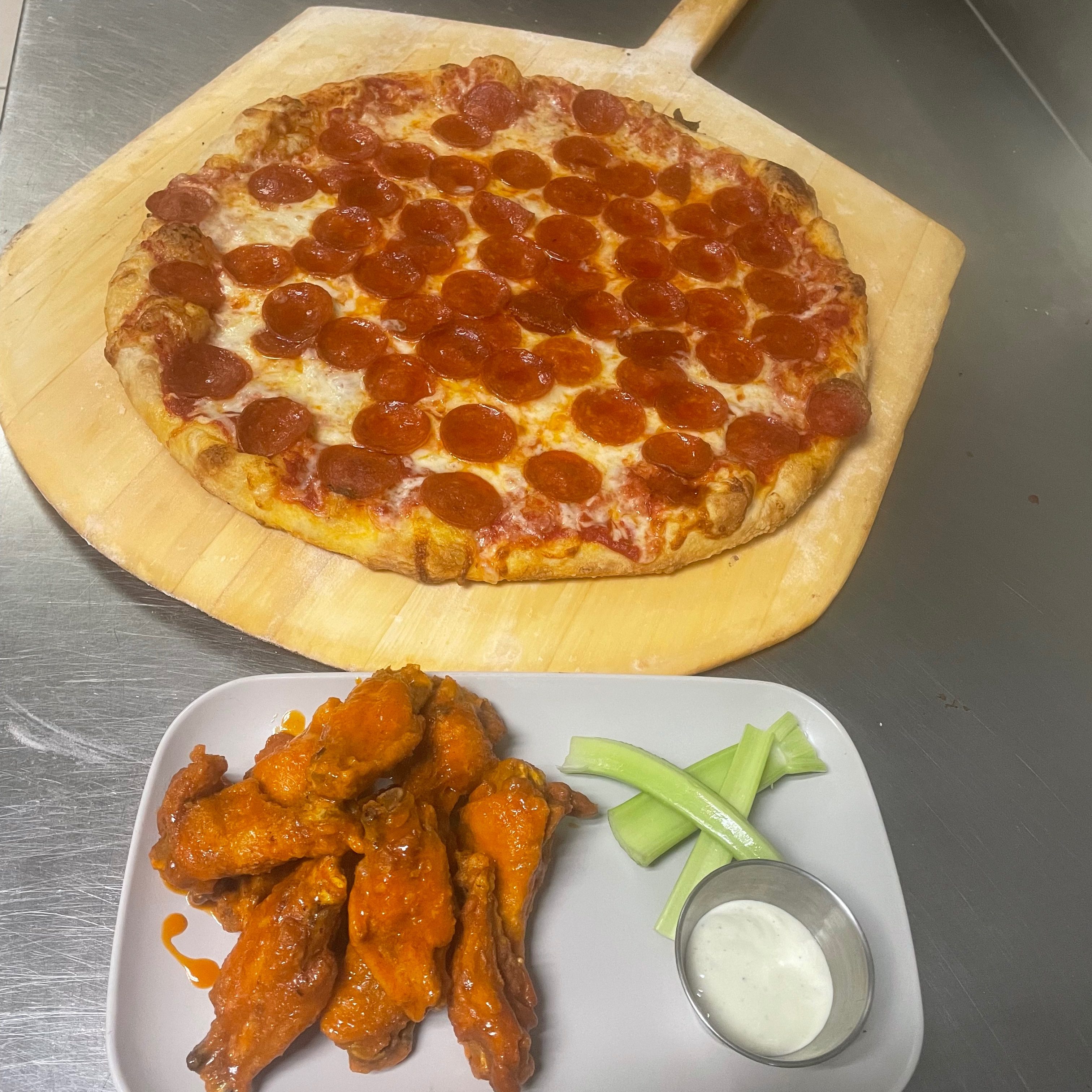 $1 Wings with Large Gourmet Pizza.