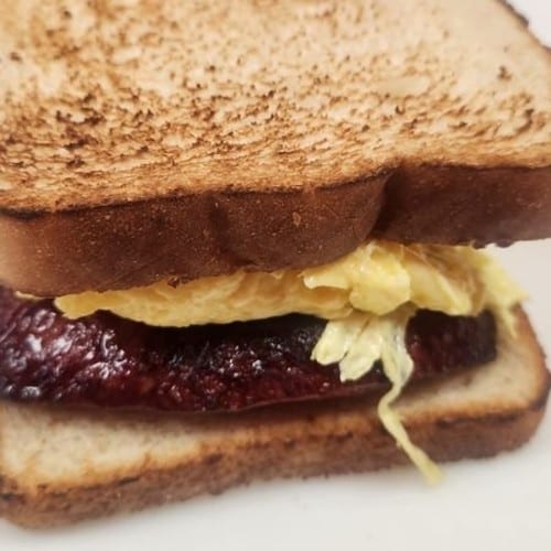 Egg And Bacon or Sausage Sandwich.