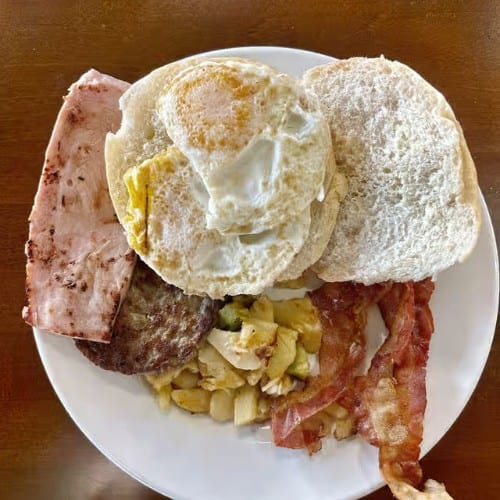 Sunrise Delight (2 Eggs, Cheese, Bacon with Home Fries).