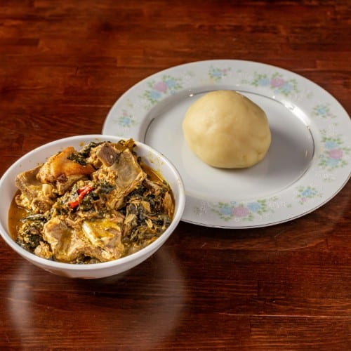Bitterleaf Soup with Yam Fufu or Corn Fufu.