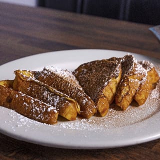 2 Eggs w/Pancakes or French Toast