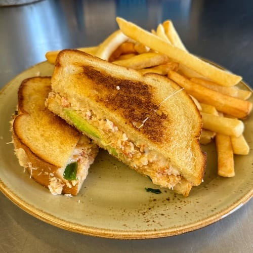 Grilled Crab, Avocado & Swiss Sandwich with French Fries.