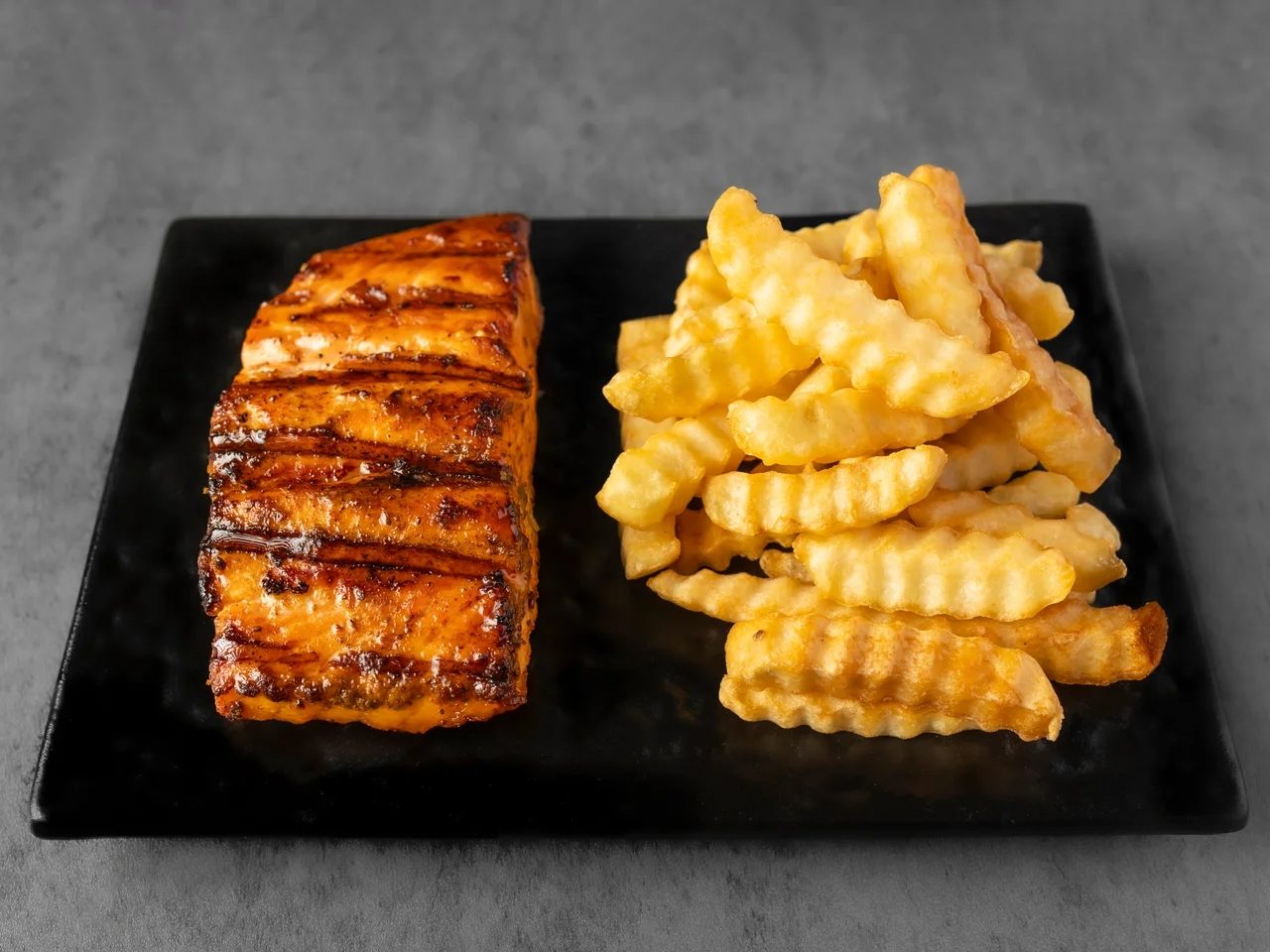 Grilled Salmon with Fries.