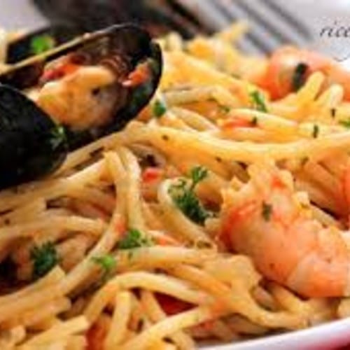 Fruiti de mare over linguine (clams, mussels, calamari, shrimp).