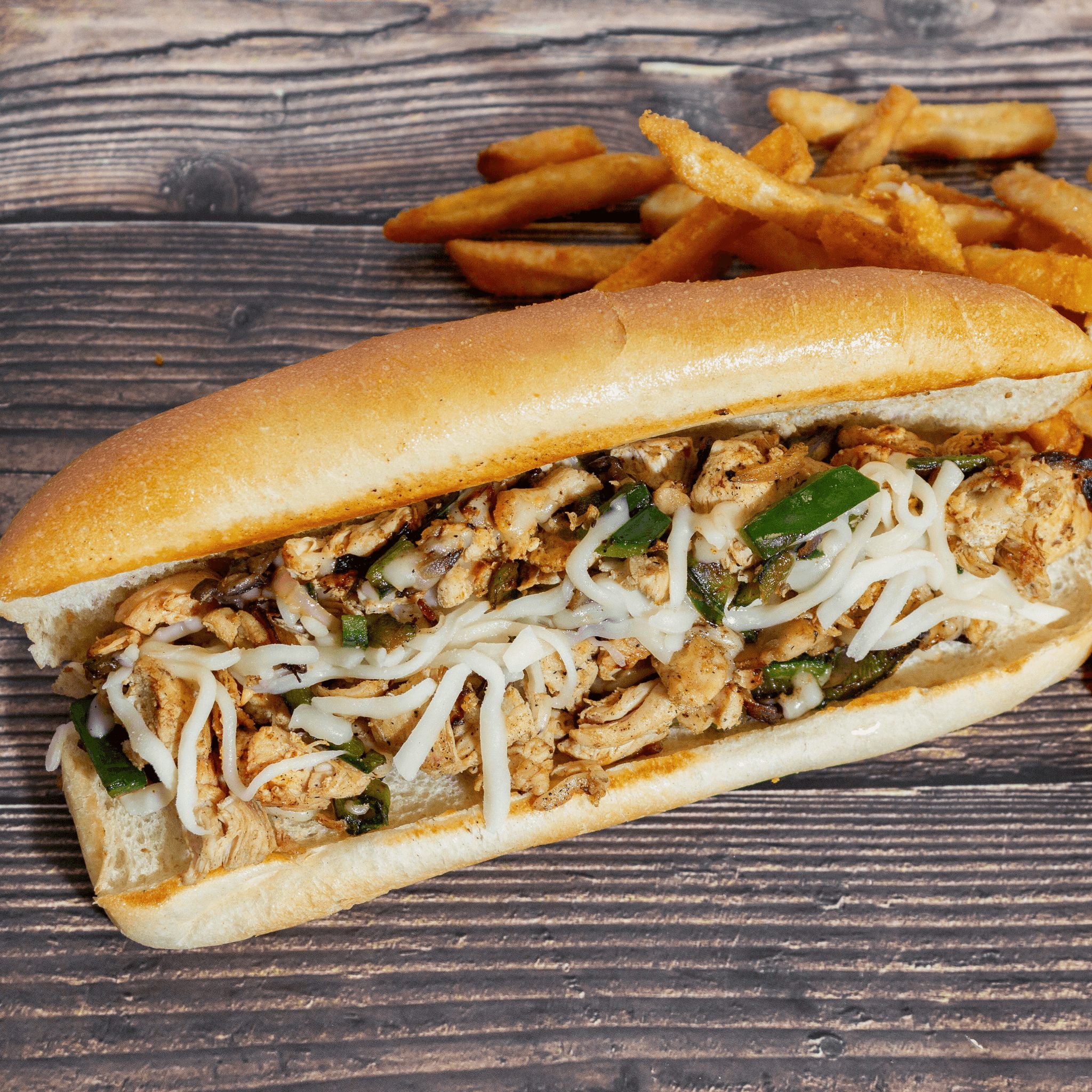 Chicken Philly sub with fries.