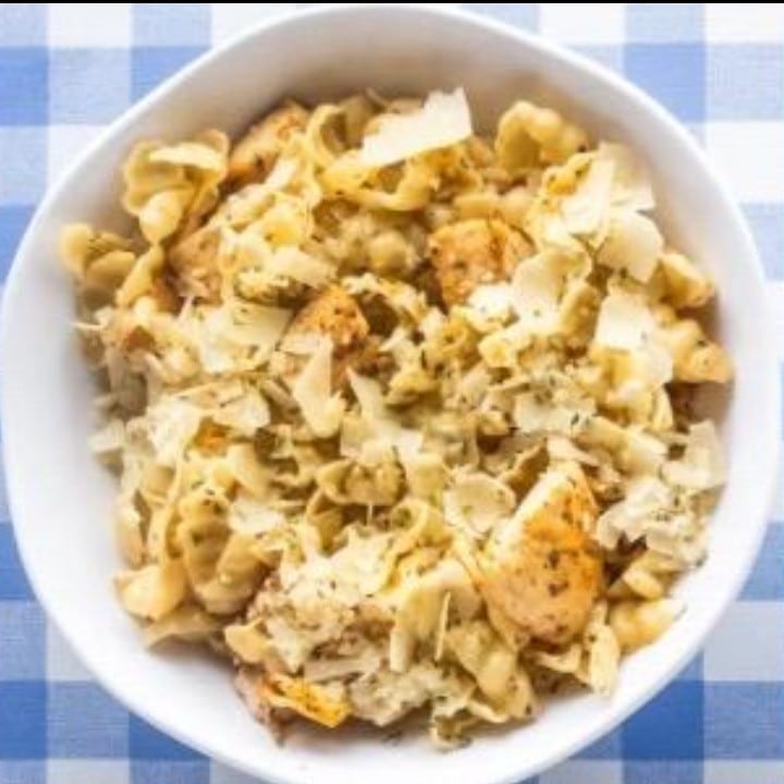 Dish of Fresh Pasta with a Side of Garlic Bread.