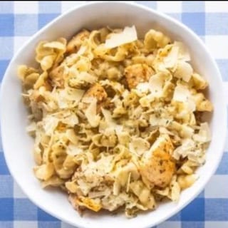 Dish of Fresh Pasta with a Side of Garlic Bread