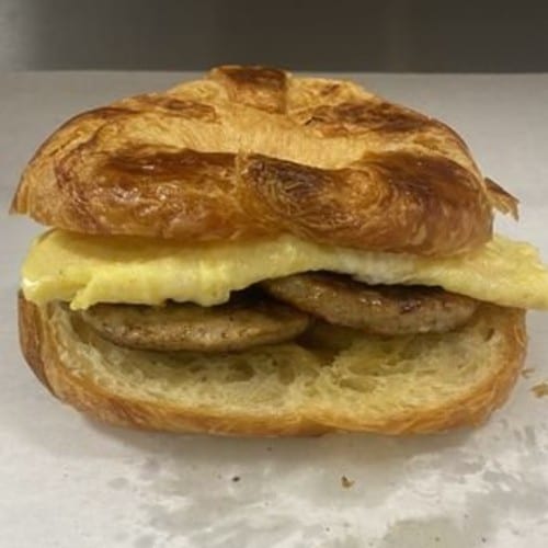Egg and Ham, Bacon, Or Sausage on Croissant.