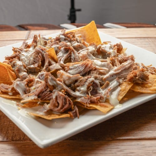60. Carnitas Nachos.