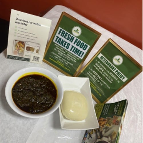 Efo Riro w/ Pounded Yam served with beef, goat, or assorted meats..