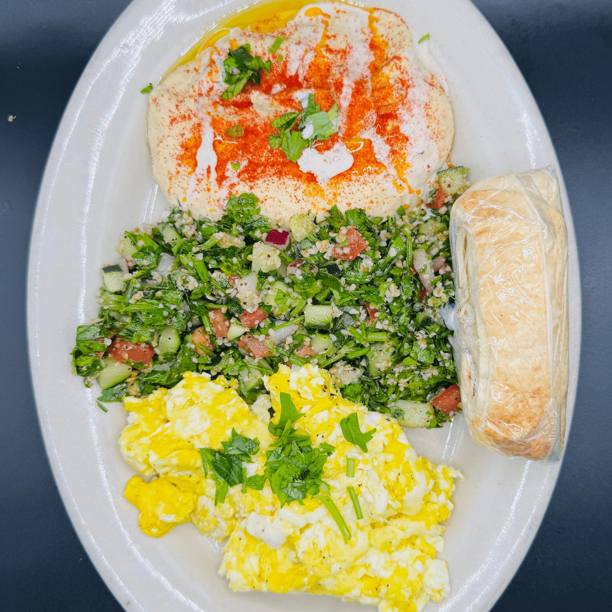 2 Eggs, Humus, tabouli & pita bread..