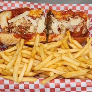 Meatball Parmigiana Sandwich With Fries. 