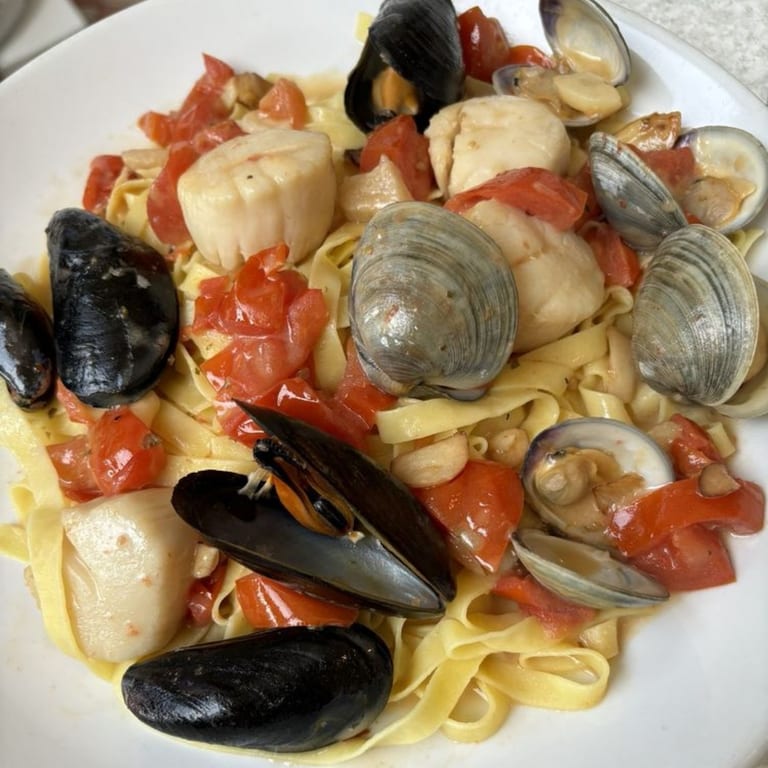 Delight in Fettuccini, Clams, Mussels & Scallops!