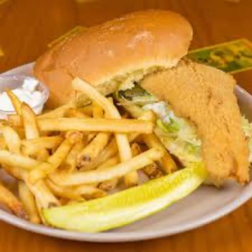 Fried Haddock Sandwich and fries and Cole Slaw.