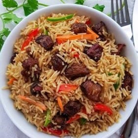 Fried Rice W/ Goat meats.