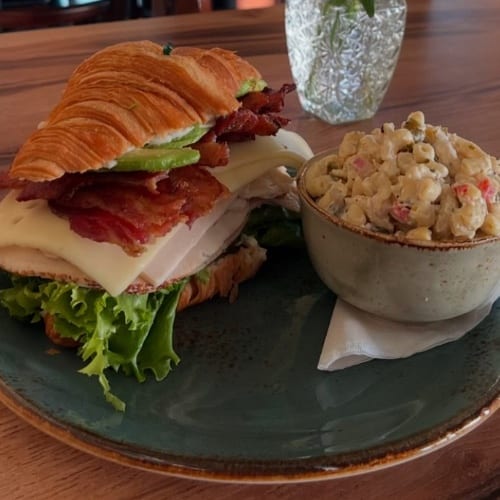 Turkey Avocado Swiss Croissant Sandwich with Choice of Side.