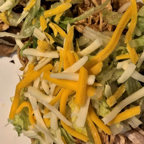 1 TOSTADA W/ PULLED CHICKEN.