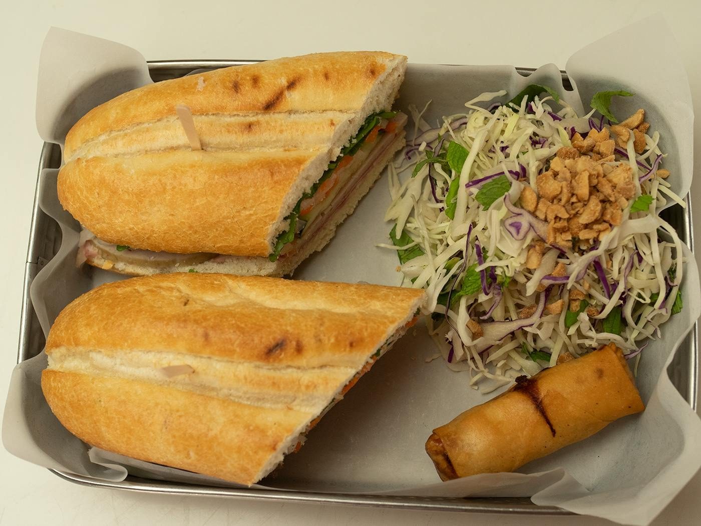 Box Lunch Sandwich- choice of Grilled ChiclledPork, Traditional, BBQ Pork, Tofu, Vegetarian Mock Beef, or Pulled Chickenken, Gri.