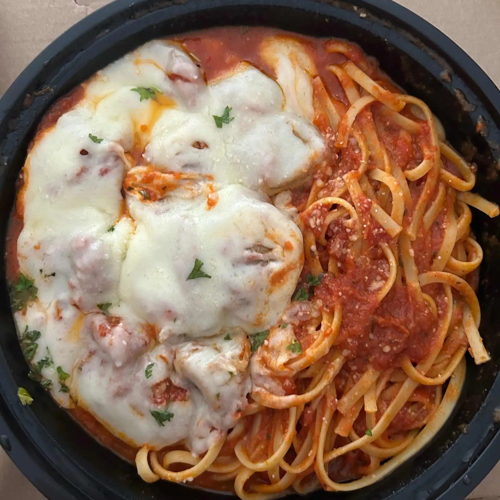 Meatballs & Sausage Parmigiana Dish.