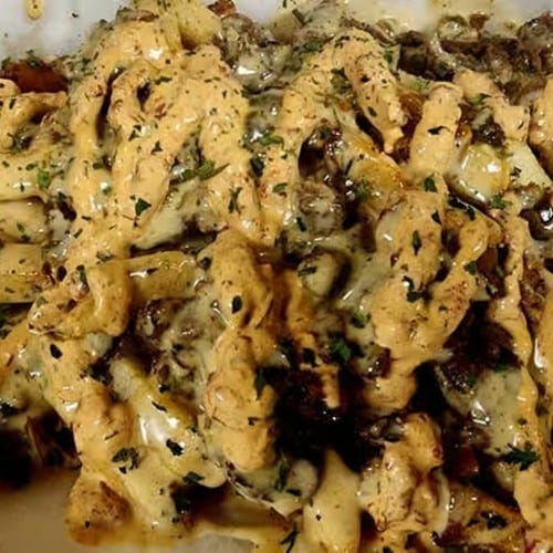 Kickin' Philly Cheesesteak Queso Fries.