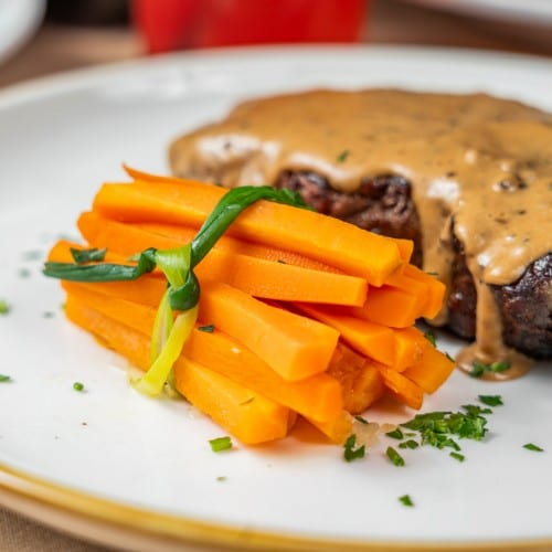 12 Oz. Shell Steak With Au Poivre Sauce.