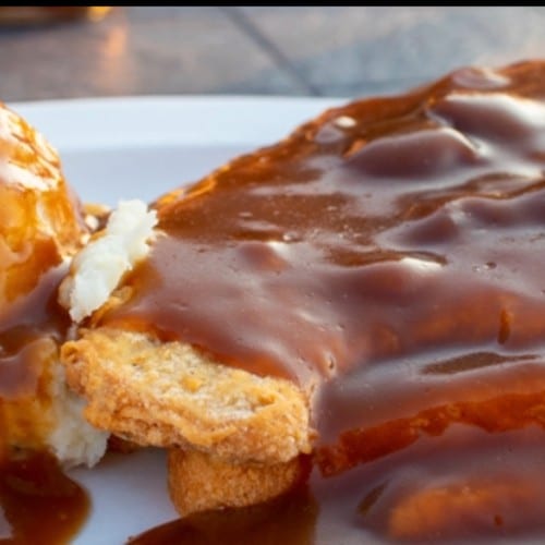Hand-breaded Tenderloin Open Face Sandwich.