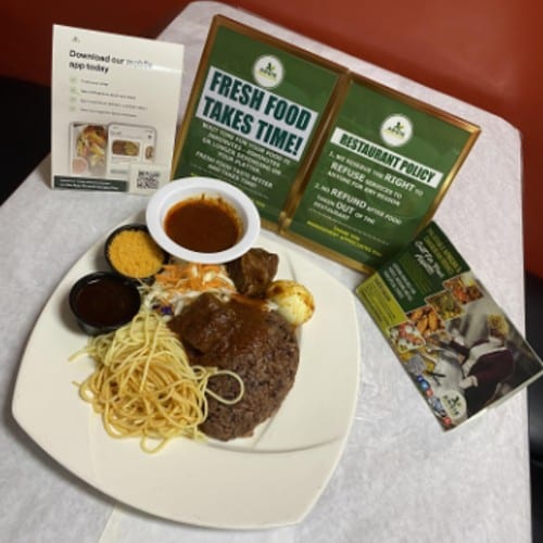 Waakye served W/ one meat, one fish, and one egg.