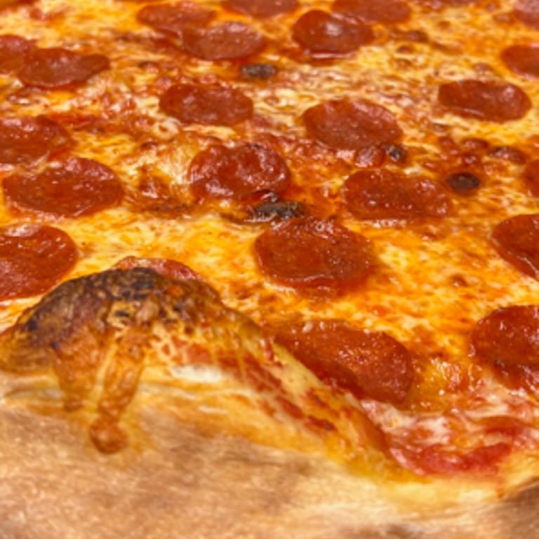 Artisanal Pepperoni Delight on Thin Crust Mastery