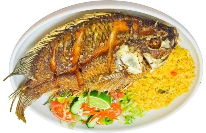 Mojarra Frita (Fried Tilapia Fish) Con Yuca Frita (Yuca Fries).