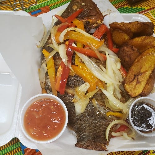 Grilled Tilapia with fried plantains.
