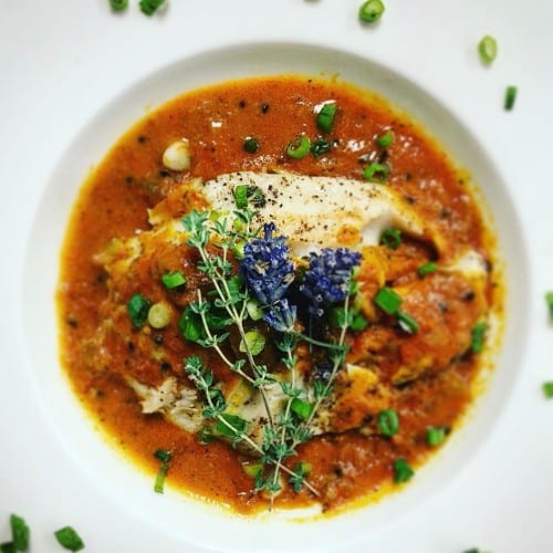 Talapia Fish in Nigella Seed Curry Served with Rice and Classic Naan.