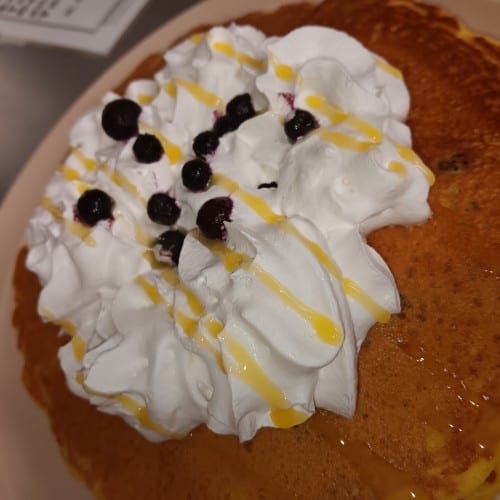 Two Chocolate Chip Hot Cakes with Whipped Cream.
