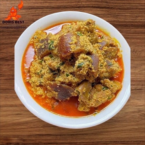 Egusi Soup with Yam Fufu  or Garri or Corn Fufu or Rice.