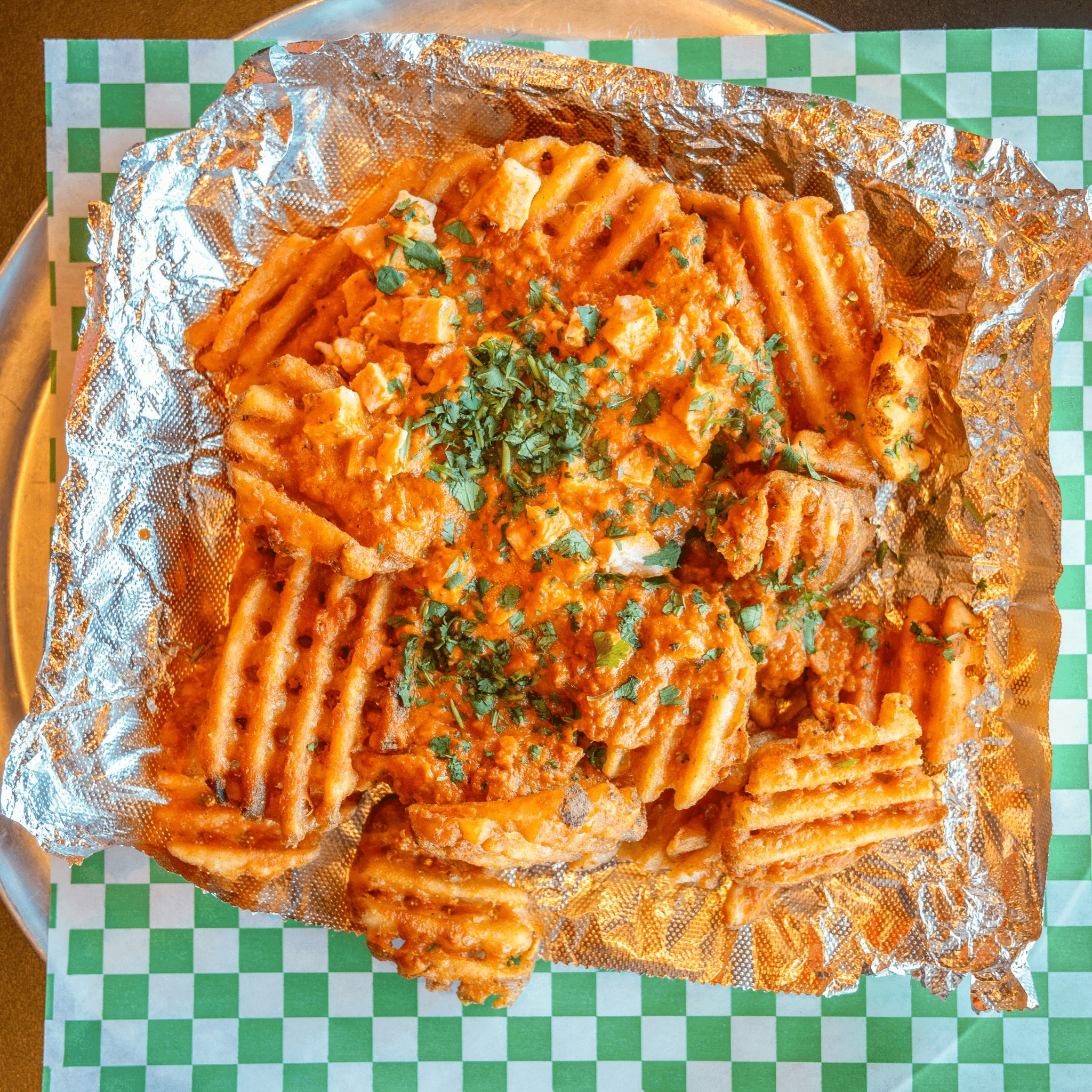 Butter Chicken Waffle Fries.