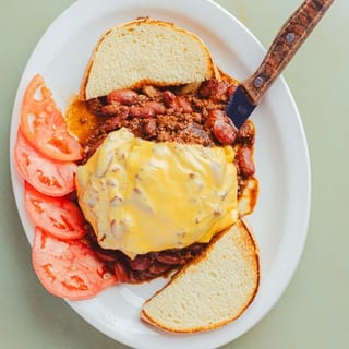 Mexi Burger (Open Faced) served with Homey Fries