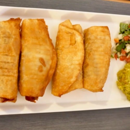 4 Mini Chimichangas served with guacamole and pico de gallo.